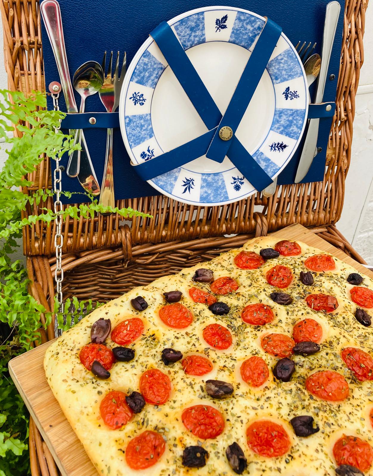 Picninc basket with cherry tomatoes and Calamanta olives Focaccia